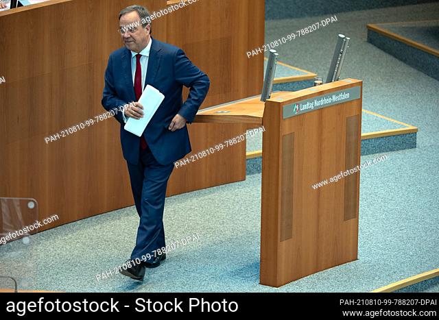 10 August 2021, North Rhine-Westphalia, Duesseldorf: Armin Laschet (CDU), Minister President of North Rhine-Westphalia, turns his back on the lectern after his...