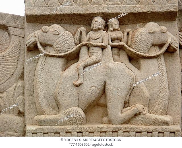 Man and a woman are seating and riding on Camels, Sanchi Stupa No 1, Purvi Toran Dwar, East gate Sanchi, Madhya pradesh, India