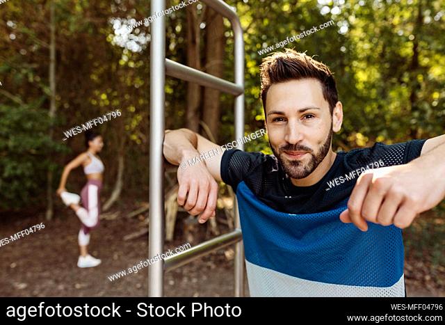Portrait of smiling man at fitness trail
