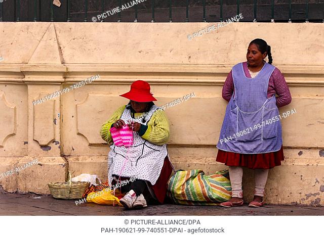 02 May 2019, Peru, Cusco: Women in traditional clothing in the townscape of Cusco Cusco was the capital of the Incas, today it is the capital of the region of...