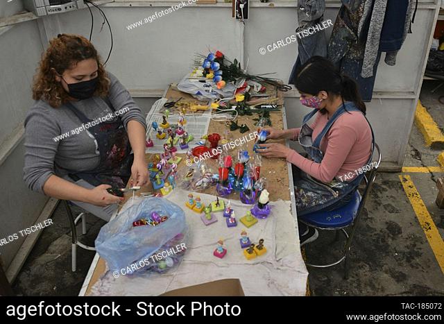 MEXICO CITY, MEXICO - JANUARY 29: A worker manufactures a valentine's ornament made of glass in occasion to celebrate San Valentine's Day