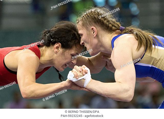 Jaqueline Schellin (red) of Germany and Valentina Islamova Brik (blue) of Russia compete in the women's Freestyle 48kg wrestling Bronze Medal Final at the Baku...