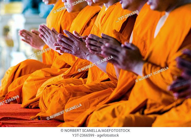 Asia. Thailand, Bangkok. Wat Benchamabophit, Marble Temple, Monks paying