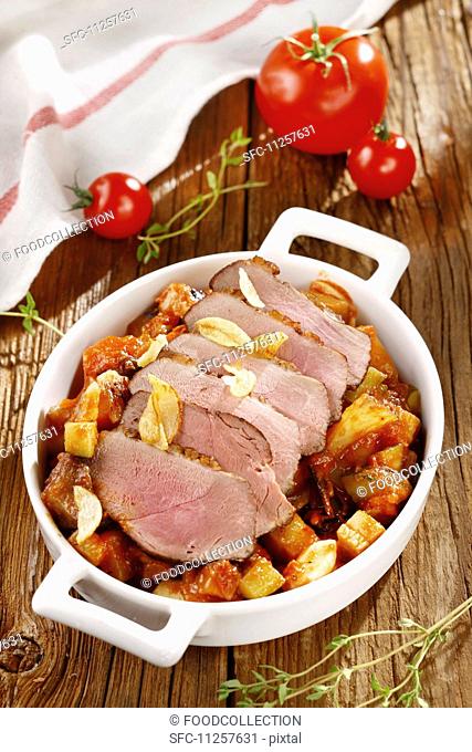 Roast pork with vegetables and garlic