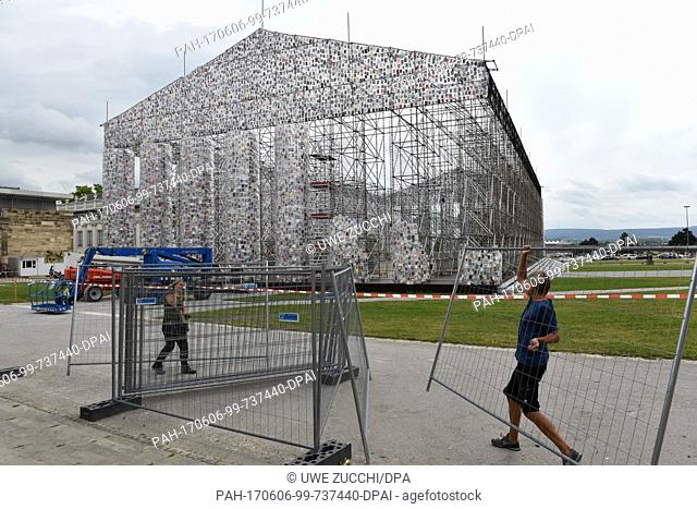 Documenta staff remove barriers around the documenta artwork ""The Parthenon of Books"" by Argentinian artist M. Minujin in Kassel, Germany, 6 June 2017