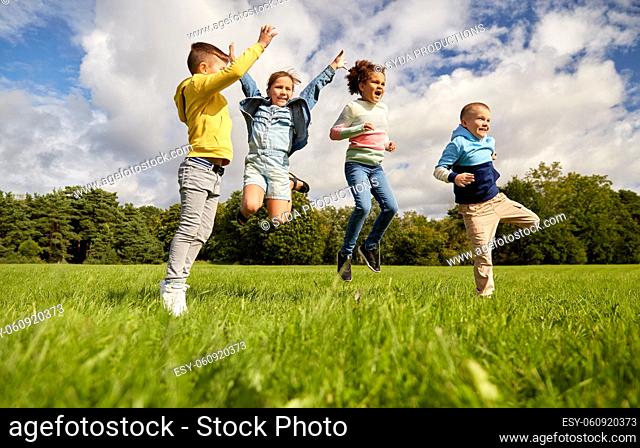 happy children jumping at park