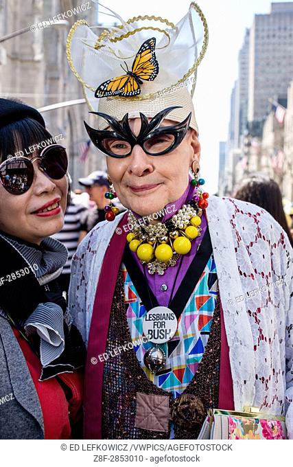 New York, NY - April 16, 2017. woman in a elaborate costume including bat-woman glasses wears a pin reading ""Lesbians for Bush. ""