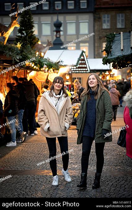 two friends experience the christmas market in bamberg, bavaria, germany
