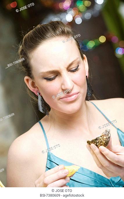 WOMAN EATING SELLFISH
