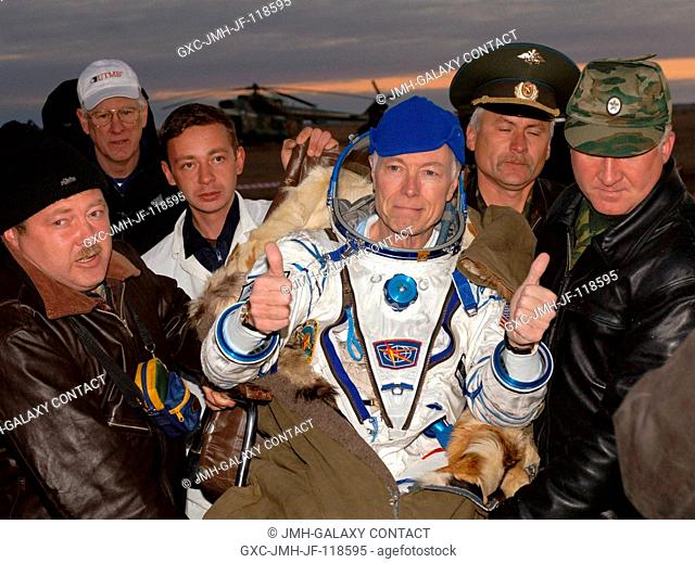 Greg Olsen, space flight participant, signals with two thumbs up following the successful landing of the Soyuz TMA-6 in Kazakhstan on Oct