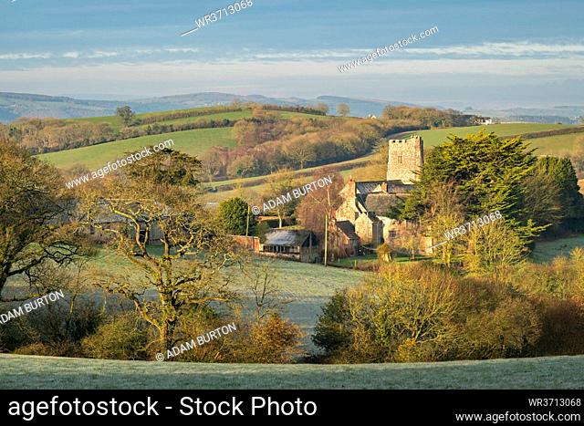 Church of St. John the Baptist at Holcombe Burnell Barton, surrounded by countryside in winter, Longdown, Devon, England, United Kingdom, Europe