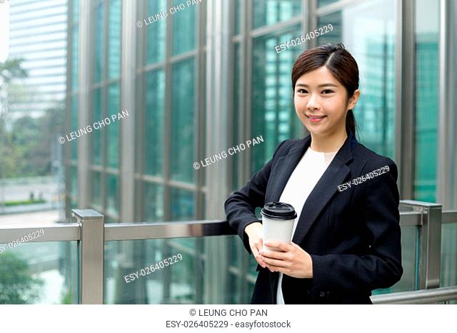 Young business woman hold with coffee cup