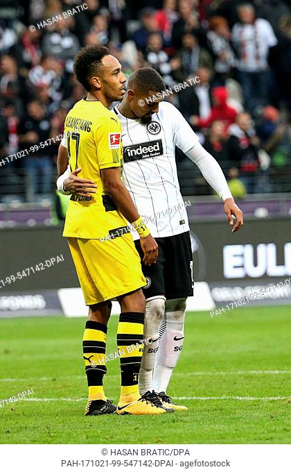 Frankfurt's Kevin-Prince Boateng (R9 and Dortmund's Pierre-Emerick Aubameyang hug each other after the German Bundesliga soccer match between Eintracht...
