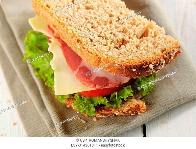 fresh deli sandwich with tomatoes, swiss chees, lettuce