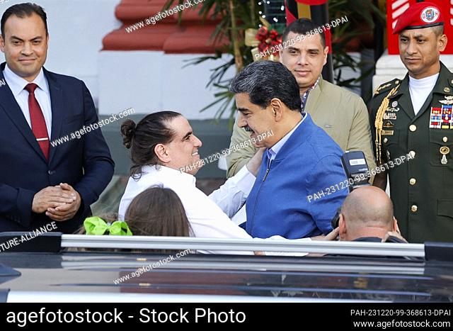 20 December 2023, Venezuela, Caracas: Nicolás Maduro (r), President of Venezuela, greets Alex Saab, Colombian businessman