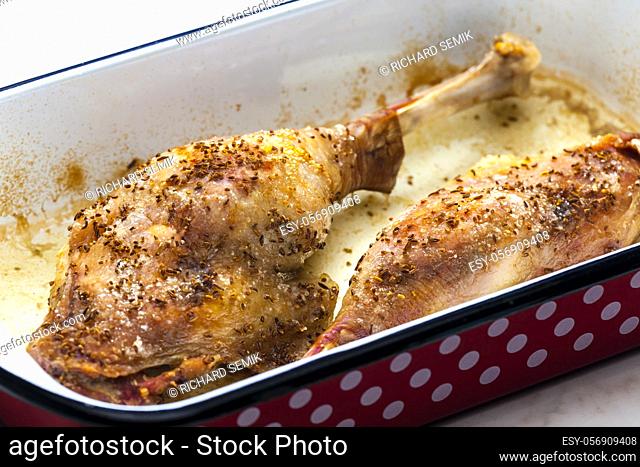 baked goose legs with cumin in frying pan