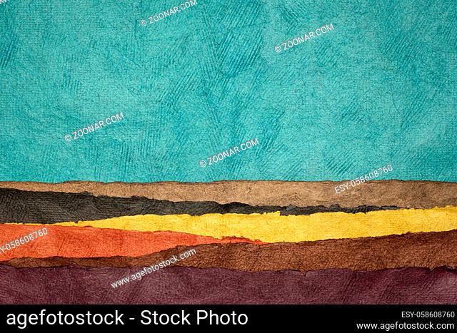 abstract landscape created with sheets of textured colorful handmade paper