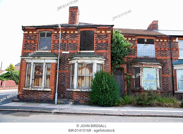 Row of boarded up derelict houses in the Bootle area, Liverpool England an area designated for the pathfinder regeneration scheme