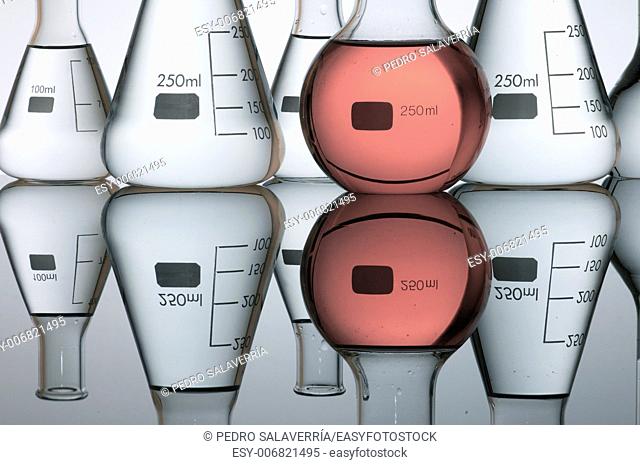 group of laboratory flasks containing liquid color