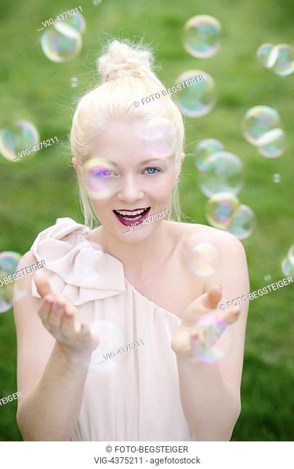 young, blond woman with soap bubbles - , 05/04/2014