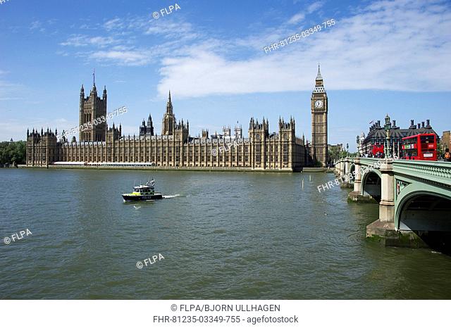 View of river with police patrol boat and bridge in city, Westminster Bridge, Palace of Westminster (Houses of Parliament), River Thames, Westminster, London