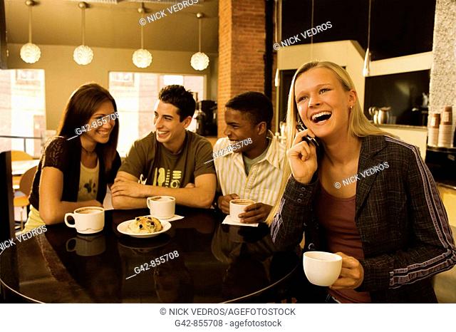 Teens hanging out in coffee shop