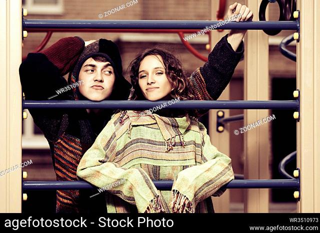 Young fashion hippie couple on the playground