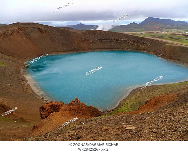 the circular crater viti in Iceland, filled with blue water