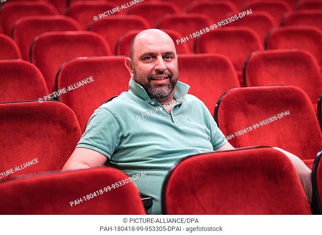 18 April 2018, Germany, Konstanz: Serdar Somuncu, director of the play ""Mein Kampf"" by George Tabori, sitting in the auditorium during a rehearsal at Theater...