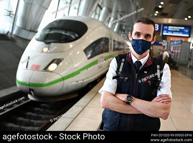 16 September 2020, Hessen, Limburg: Locomotive driver Sascha Weise is standing on the track of the Frankfurt Airport mainline station while an ICE3 is entering