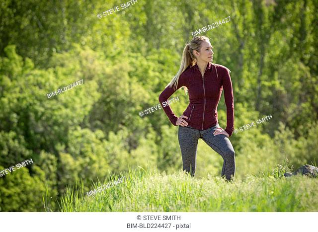 Caucasian woman standing on hill