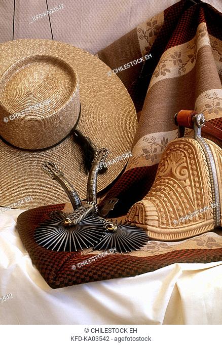 Chile, Huaso straw hat, wooden stirrups, metal spurs and manta, South America