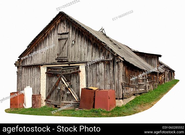 Abandoned aged wooden vintage retro rural shed for storage of firewood and agricultural tools. Isolated on white with patch