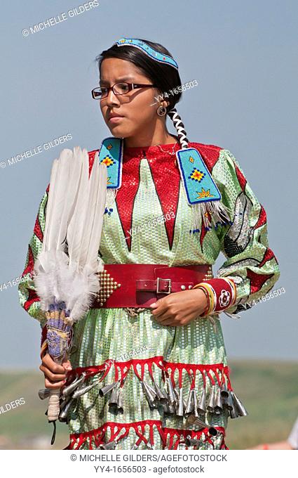 Female dancer in jingle dance regalia, Pow-wow, Blackfoot Crossing Historical Park, Alberta, Canada