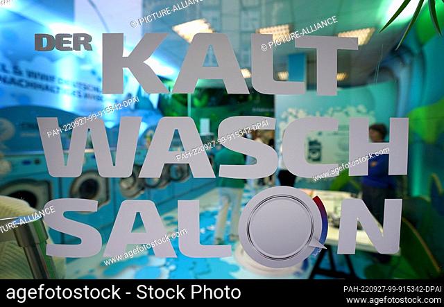27 September 2022, Hamburg: ""The cold laundromat"" is written on the entrance door during the cold laundromat campaign in the Winterhude district