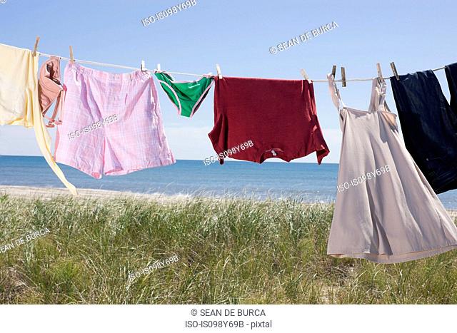Laundry drying on clothes line by sea