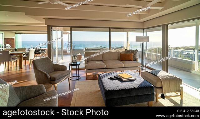 Luxury home showcase living room with sunny ocean view