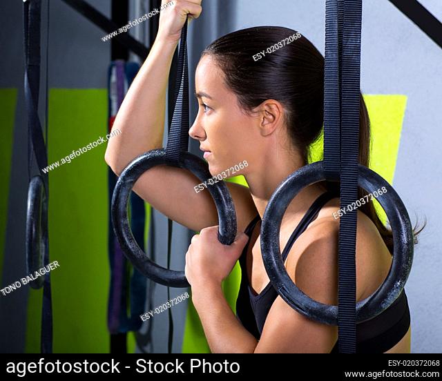 Crossfit dip ring woman relaxed after workout at gym