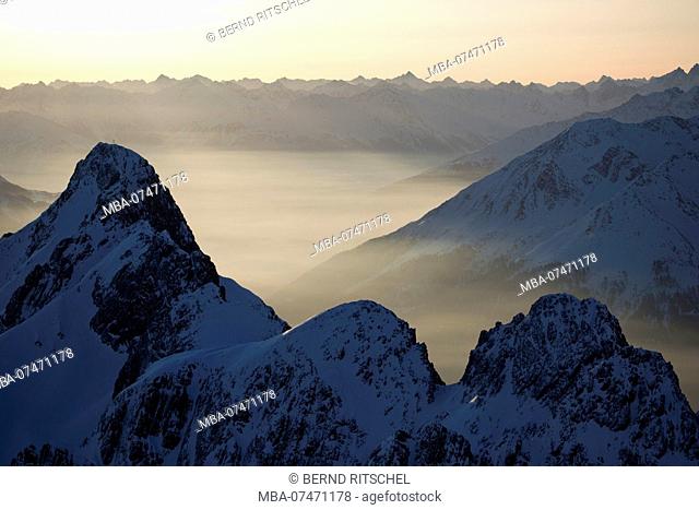 View from Valluga to Weisschrofenspitze at sunrise in winter, Arlberg, Lechtaler Alps, Tyrol, Austria