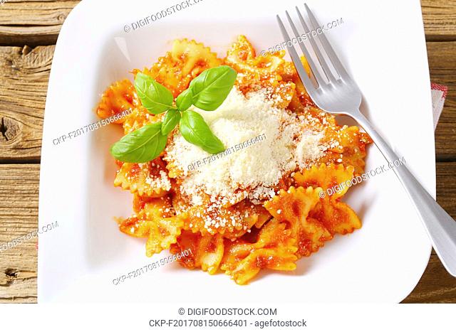 Bow-tie pasta with tomato sauce and parmesan