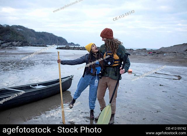 Carefree couple canoeing, Kent, UK