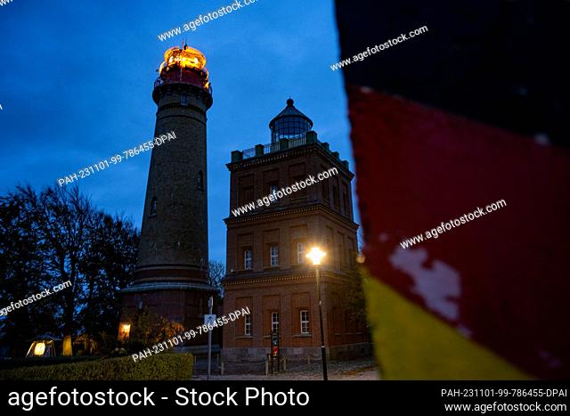01 November 2023, Mecklenburg-Western Pomerania, Putgarten auf Rügen: The Cape Arkona lighthouse on the island of Rügen sends its light out into the Baltic Sea