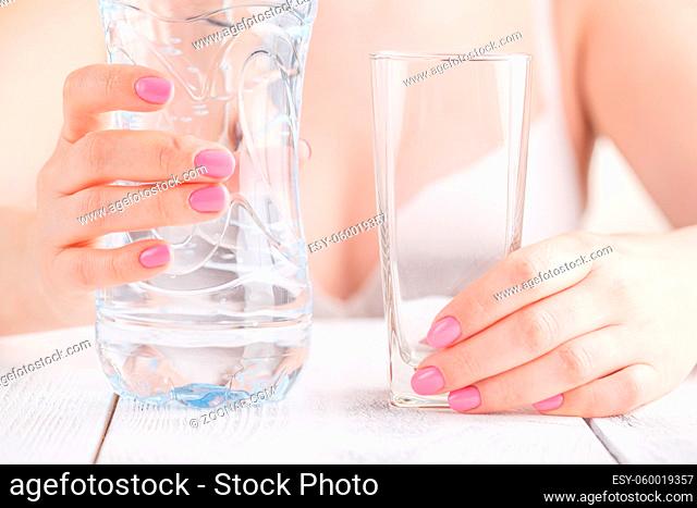 woman giving a glass with water