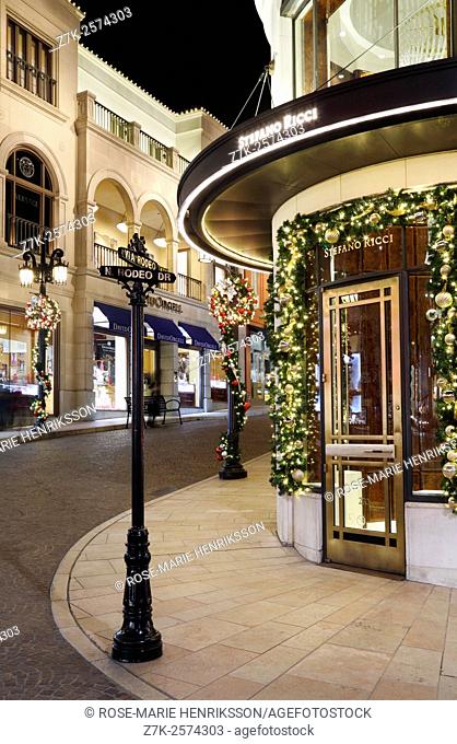 Luxury shops and boutiques on via Rodeo and Rodeo drive, Beverly Hills. Christmas decorations at night