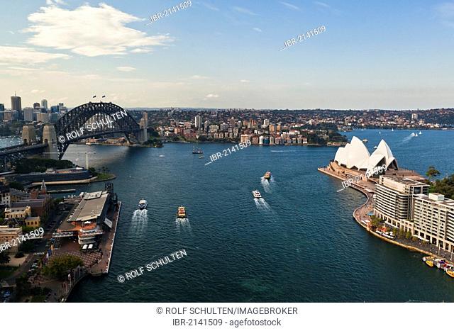Sydney Cove, with the Opera House and Sydney Harbour Bridge in the harbour, Sydney, New South Wales, Australia