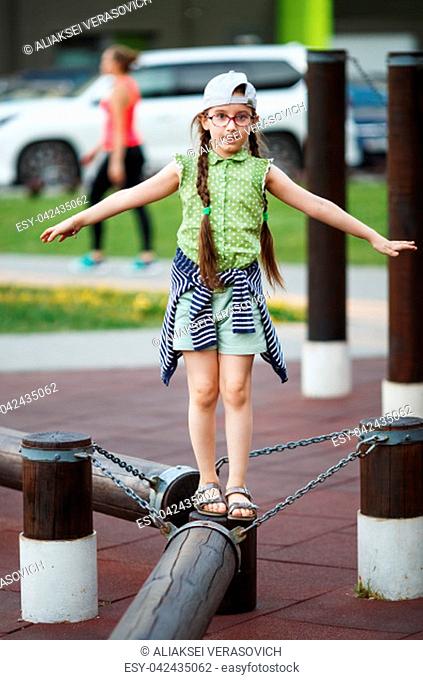 Child girl balancing. Selective focus