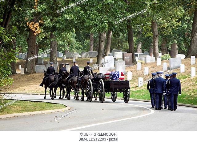 Carriage pulling casket to military cemetery