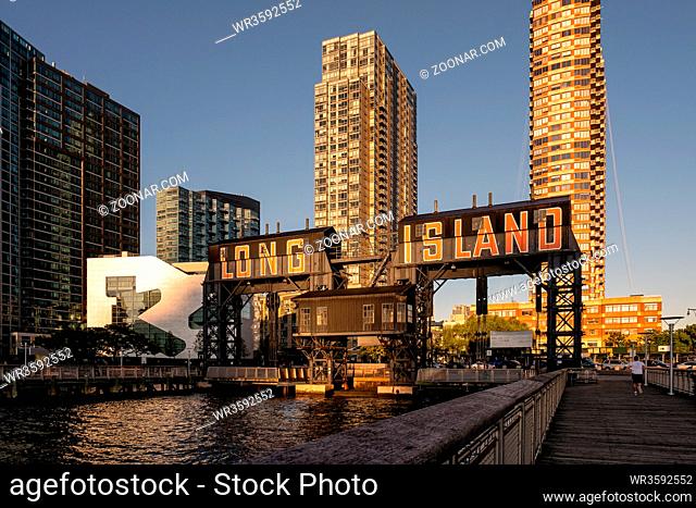 Queens NY - USA - Aug 29 2019: Long Island City Gantry sign and Manhattan midtwon skyline in front of east river