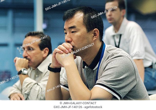 Astronauts Soichi Noguchi (foreground) and Charles J. Camarda, both STS-114 mission specialists, participate in a classroom session in the Neutral Buoyancy...