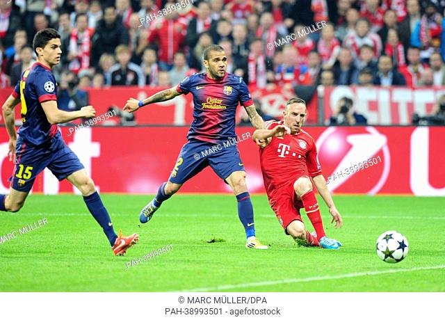 Munich's Frack Ribery (R) and Barcelona's Daniel Alves (C) and his team mate Marc Bartra vie for the ball during the UEFA Champions League semi final first leg...